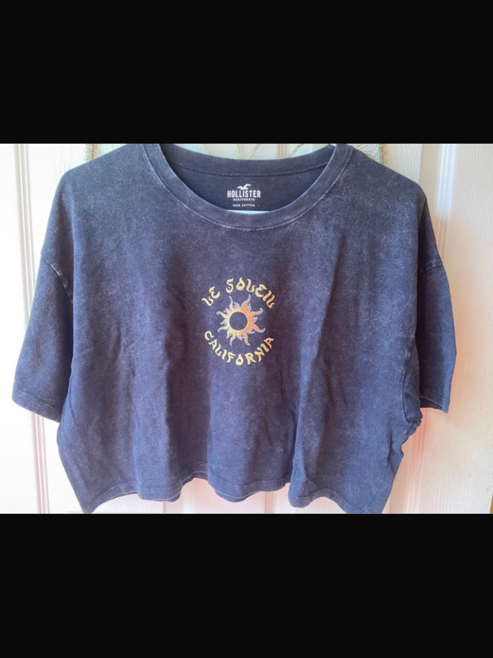 Hollister Washed Black Cropped Tee with Yellow-Orange Sun Graphic